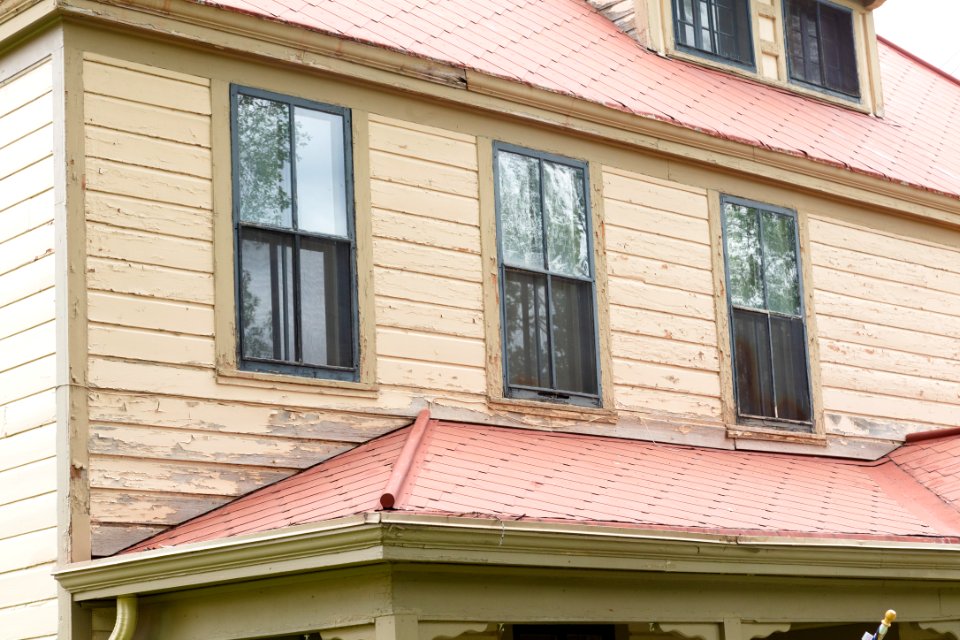 Historic housing exterior comparisons: old paint detailed front view