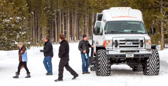 Visitors on snowcoach tour stopping at Canyon VEC
