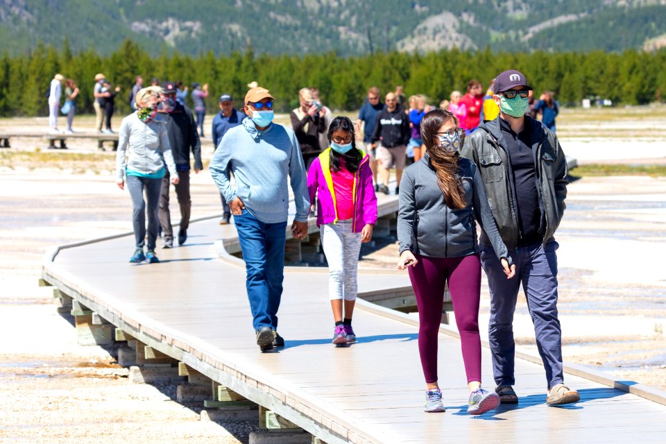 People exploring Midway Geyser Basin