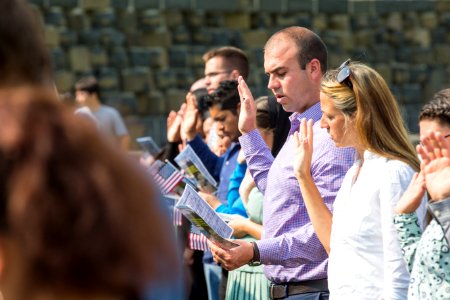 Applicants take the Oath of Allegiance at a naturalization ceremony photo