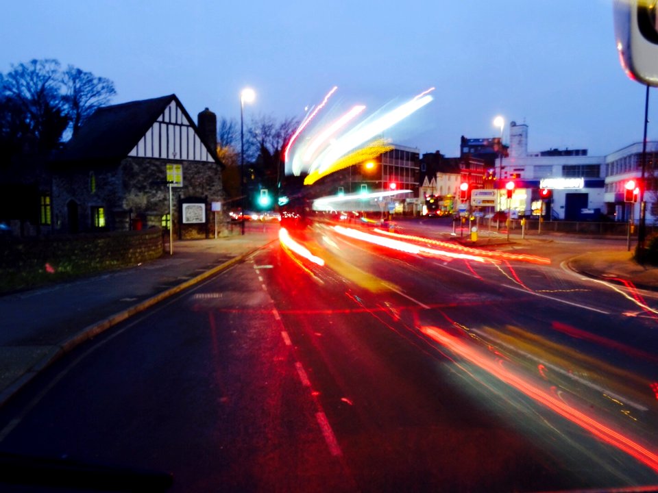 DOUBLE DECKER BUS PASSING  AT NIGHT