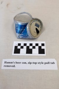 Ear Spring ejecta - beer can with label and scale photo