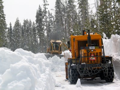 Pushing snow to the blower at Lewis River