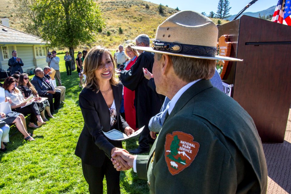 Yellowstone Deputy Superintendent Steve Iobst congratulates a new citizen.