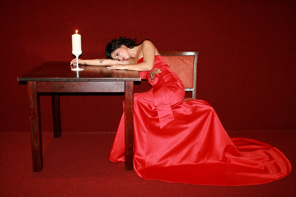 Lady in red table candle