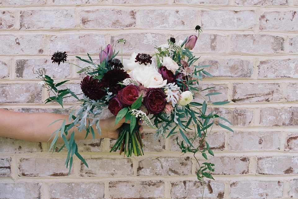 Holding brickwall floral