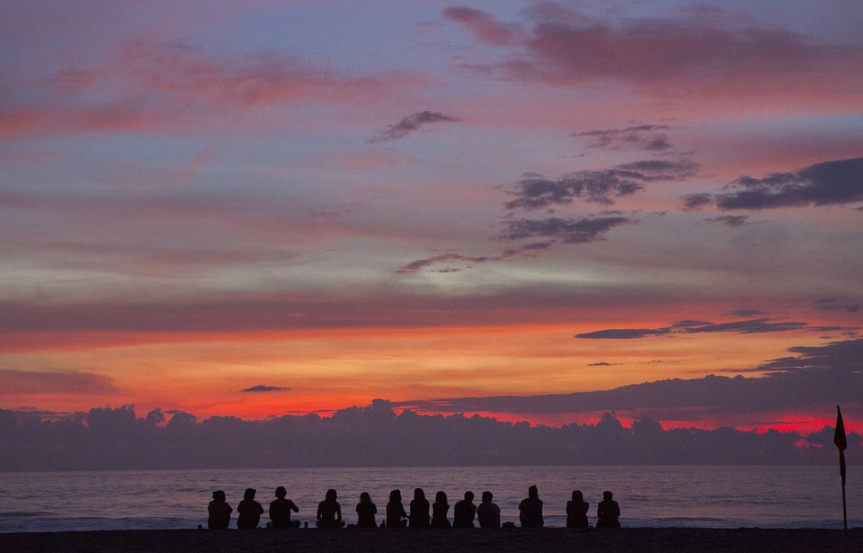 Silhouettes sitting beach