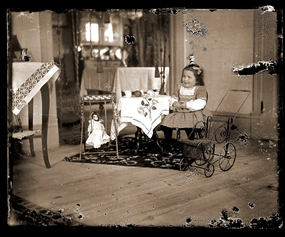 Girl having a tea party, c1913