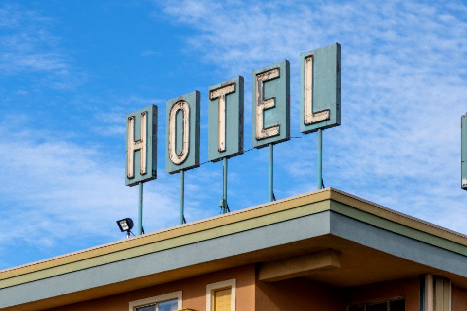 old school neon hotel sign on Rodeway Inn