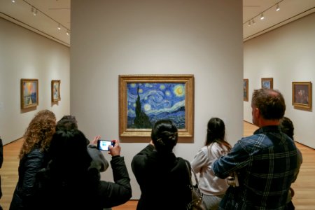 crowd looking "The Starry Night" at MOMA photo