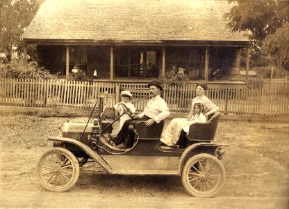 Unidentified family in a Ford Model T Tourabout, c1910 photo