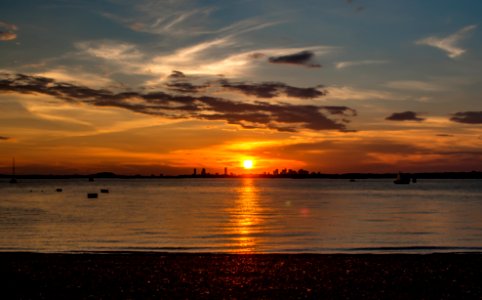 Sunset behind Boston from Peddocks Island photo