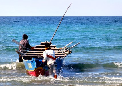 Launching the boat. Philippines. photo