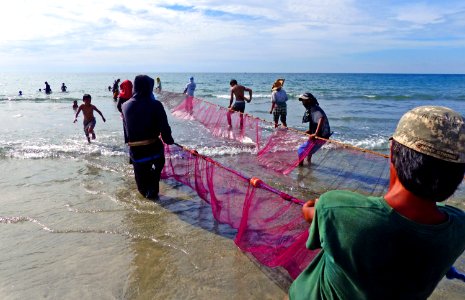 Hauling in the nets. Philippines. photo