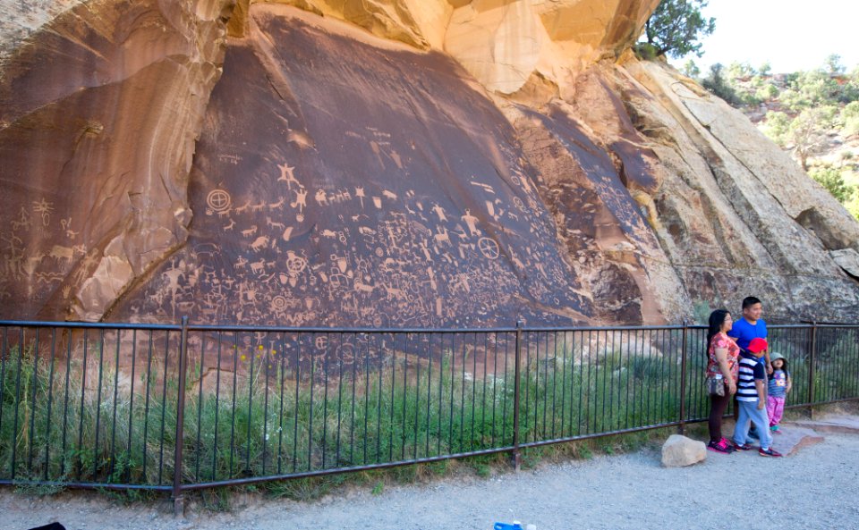 Family visiting Newspaper Rock