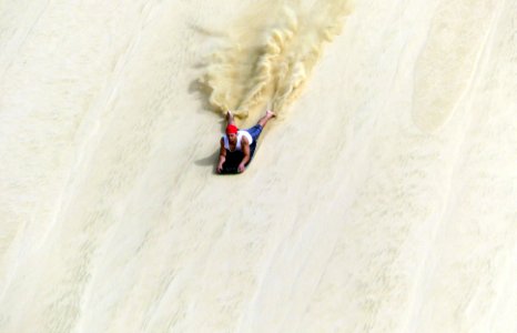 Sand Surfing Te Paki Sand Dunes. photo