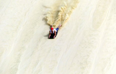 Sand Surfing Te Paki Sand Dunes.