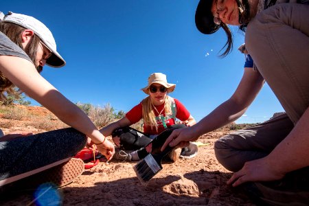 The students split up into teams to study the tracks. Moab, UT. Photo by Eric Delphenich