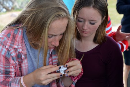 Girls study science.