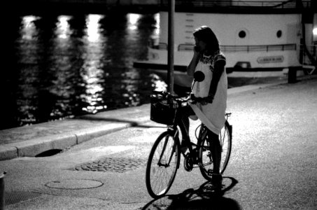 Girl with bicycle near the Seine photo
