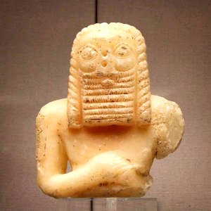 Stone statue of a man  Calcite statue of man with long hair and a beard. The inscription on the shoulder, probably the dedicator's name, has not yet been deciphered. The statue was clearly appreciated for a long time, as cuneiform on the back dates to 100
