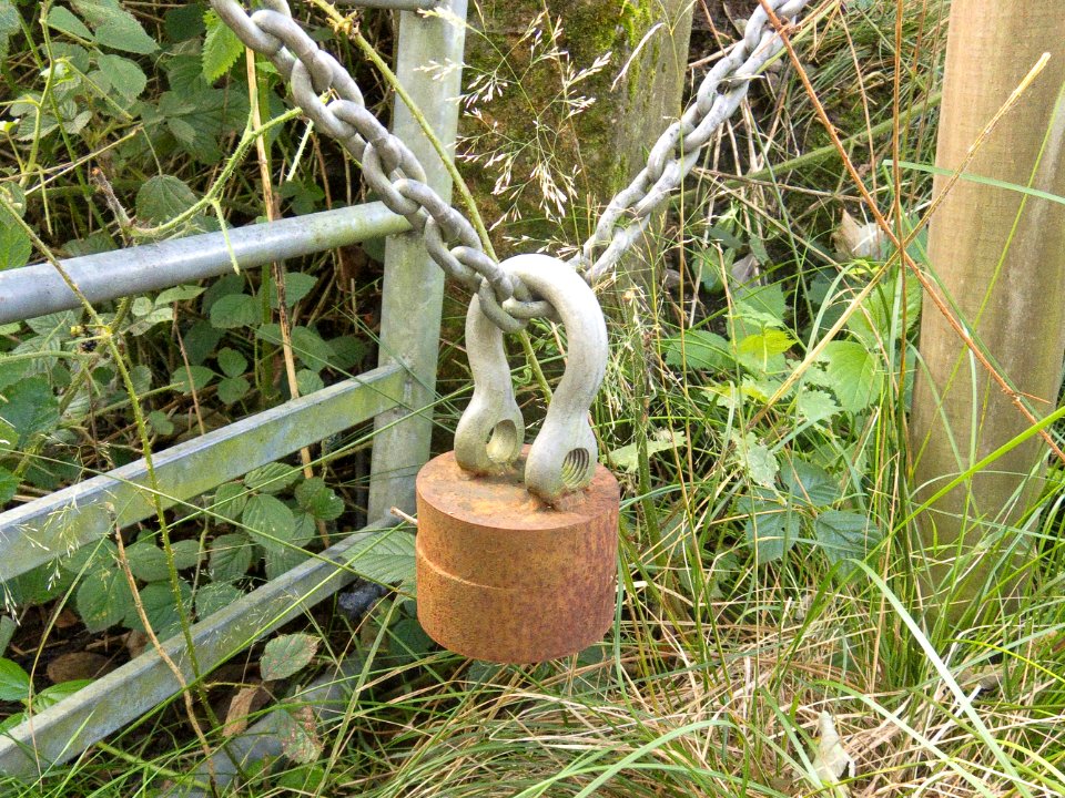 Metal cylinder with welded shackle.