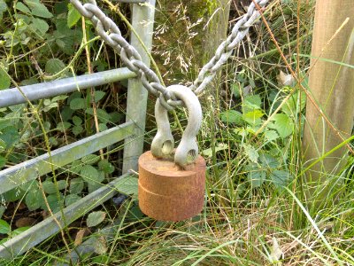 Metal cylinder with welded shackle.