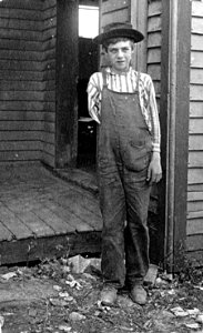 Child Labor: Boy lost arm running saw in box factory, 1909 photo