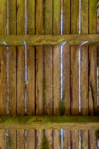 Under view of wooden bridge over a creek photo