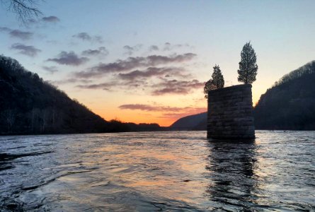 Sunrise at the river confluence this morning featuring the Shenandoah Bridge pier ruins, and purple clouds! (NPS Photo/Hammer)~mh #thecolorpurple #harpersferry #sunrisegram #harpersferrynps #historicbridge