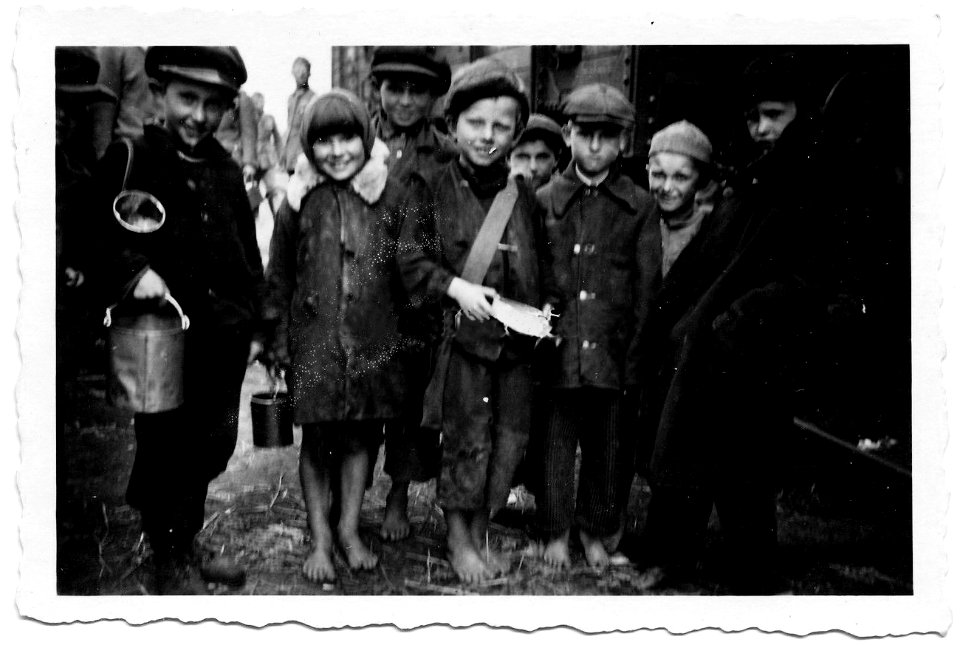 Poor, barefoot children begging for food, Nazi-occupied Europe, World War II
