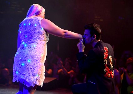 Jordan Knight kissing a fan’s hand