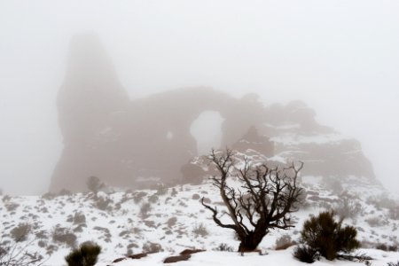 Turret Arch, obscured by fog.