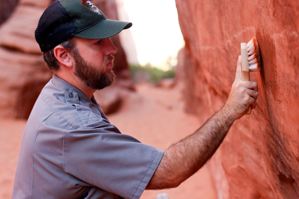 Stephen Allen removes graffiti