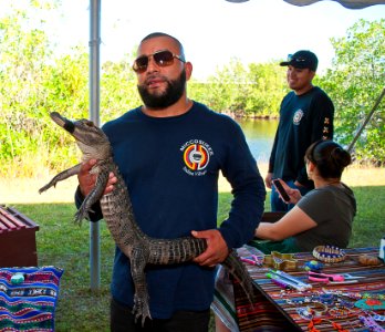 Miccosoukee representative Dino with his four-year-old gator "Roscoe"