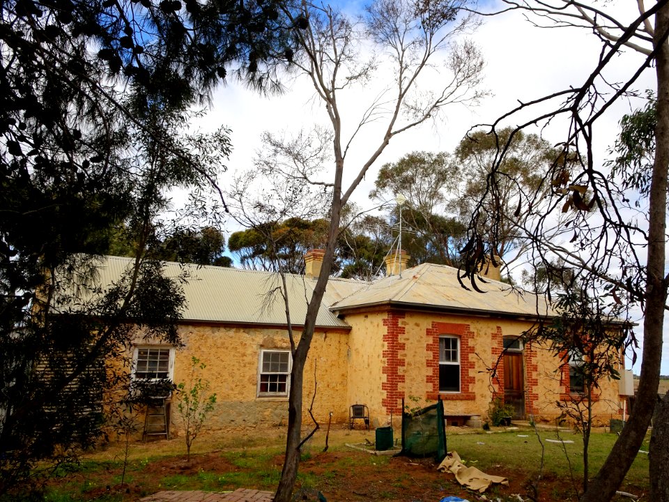 Angas Plains. On the left the original 1861 community school. It became a state school 1875. Additions made in 1890s. Closed 1947. Used as a community hall until 1991.