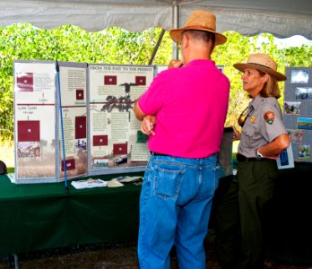 NPS Ranger Lisa Andrews discussing the festival with Peter