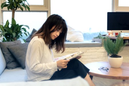Business Woman is reading Newspaper photo