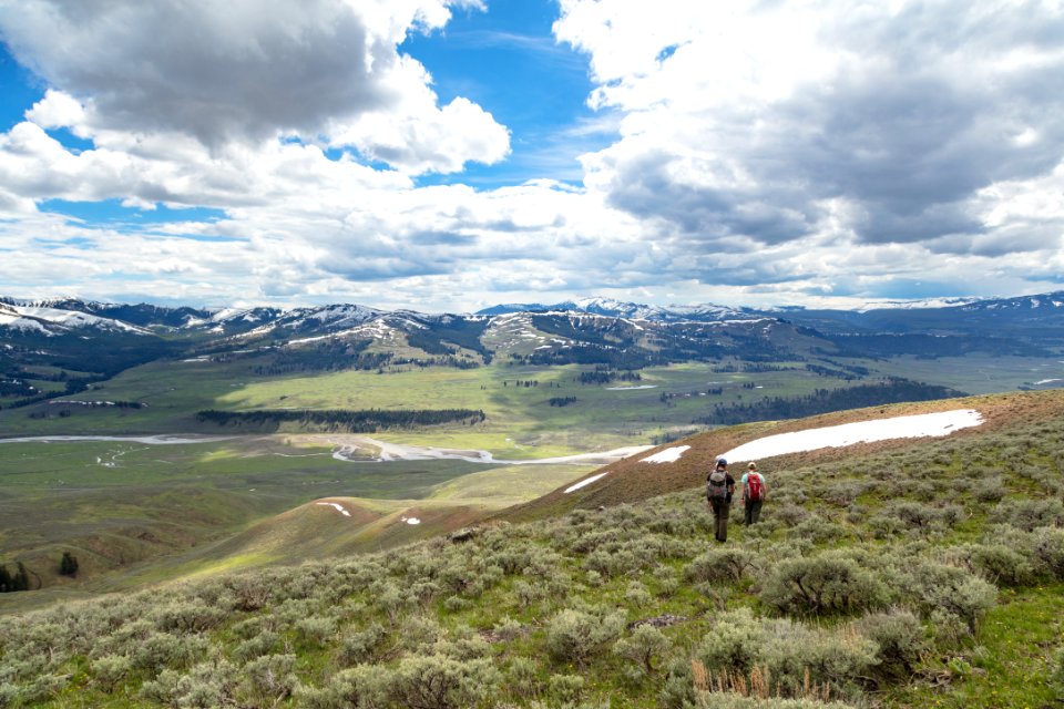 Hikers overlooking Lamar Valley from Bison Peak ridge