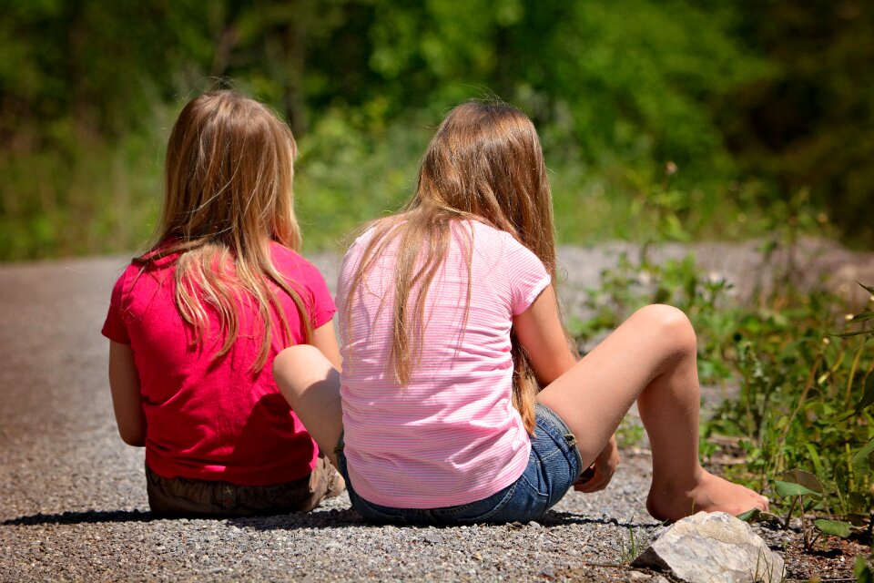 Girl blond long hair sitting
