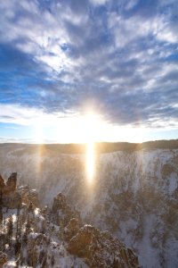 Sun dog and big sky over the Grand Canyon of the Yellowstone (portrait) photo