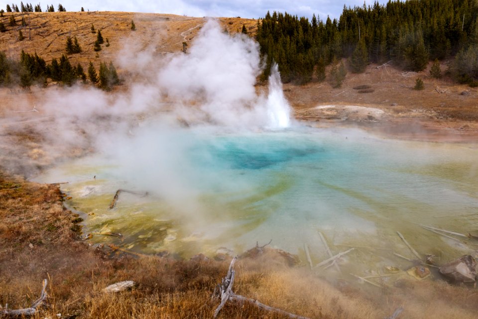 Imperial Geyser erupting on a cloudy fall afternoon