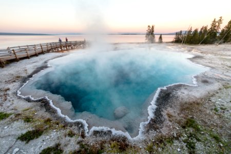 Family enjoying a sunset near Black Pool in West Thumb Geyser Basin