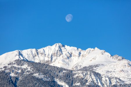 The moon above Electric peak after a winter storm