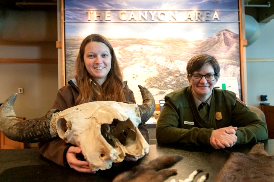 Ranger Stephanie and volunteer Jenna staff the Canyon Visitor and Education Center desk in winter