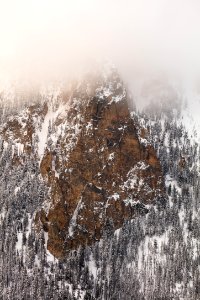 Bunsen Peak with low clouds after a spring snowstorm photo