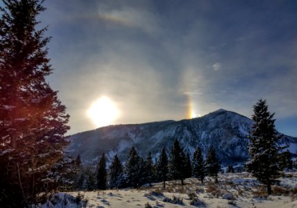 Bunsen Peak with 22 degree halo and sundog in background. photo