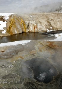 East Chinaman Spring with Cascade Geyser across the Firehole River