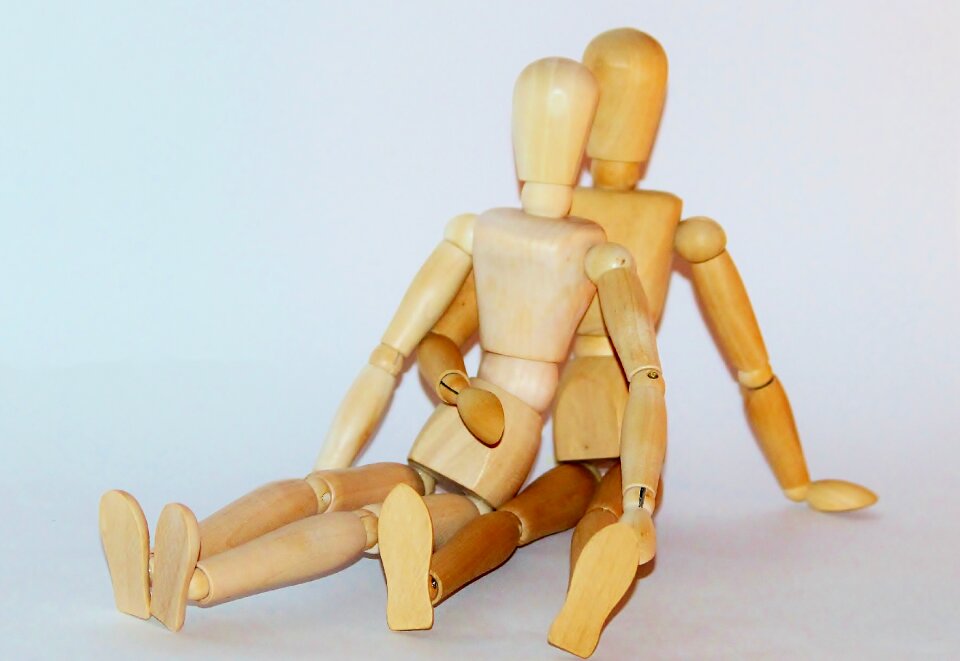 Pair wooden figures sit