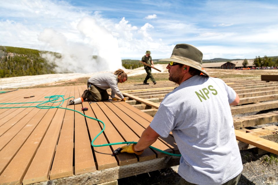 Board walk crews replacing the decking at Old Faithful